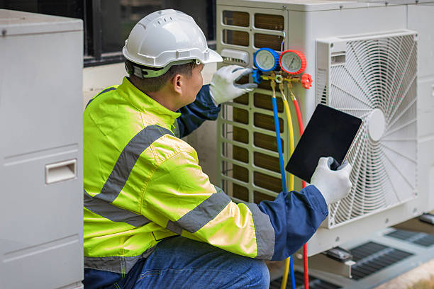 Professional Air Conditioning Repair technician working in Kewaskum, WI